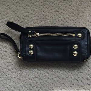Linea pelle collection black wallet/wristlet. Gold tone studded accents.